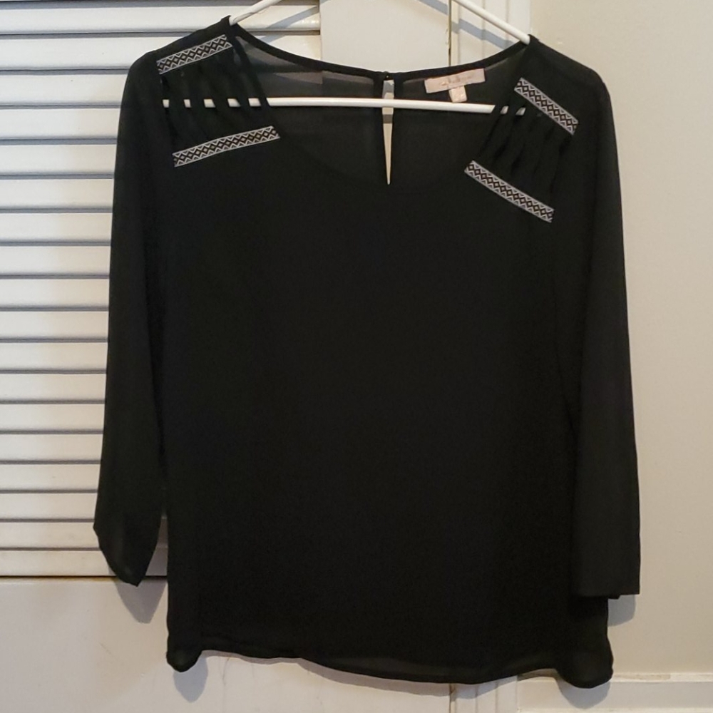 Black Blouse with design around scoop neck.